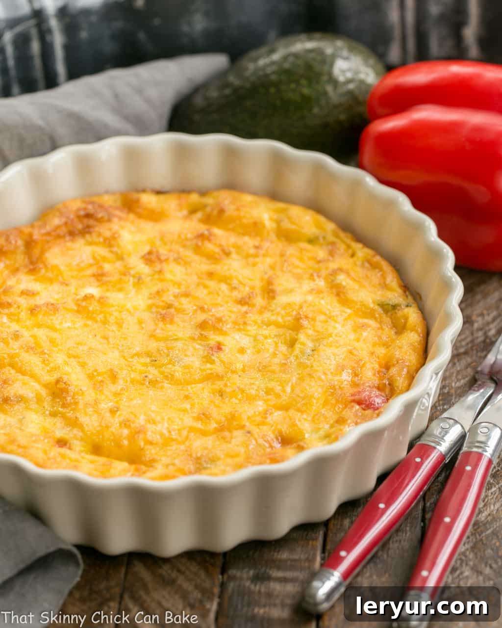 Baked Denver Omelet - A simple, scrumptious, easy to make baked ham and vegetable omelet! Baked Denver Omelet in a white porcelain dish.