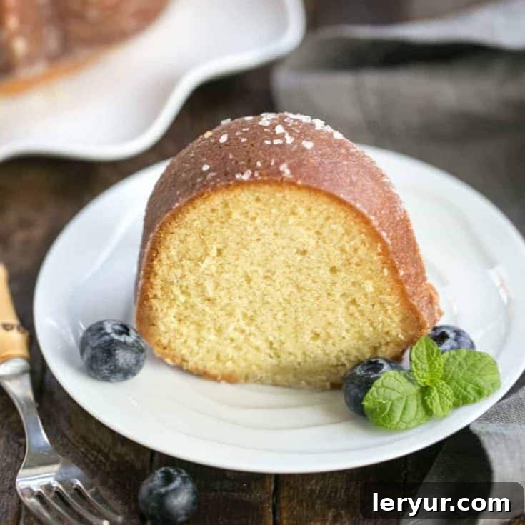 a slice of Kentucky butter bundt cake, showing its moist interior and golden crust
