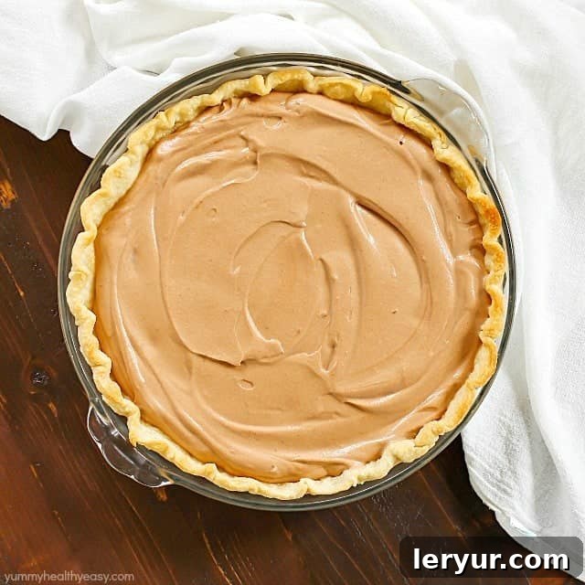 A slice of Mom’s Easy Chocolate Pie, showing its decadent, rich chocolate filling.