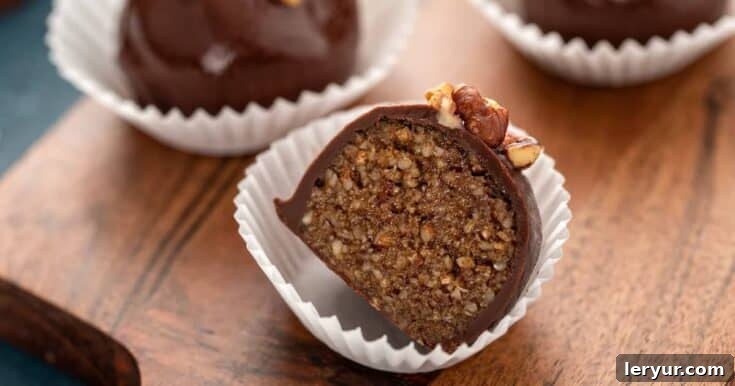 Pecan Pie Truffles coated in chocolate, perfect for a small, rich bite.