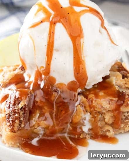 Caramel Apple Pie Bars with Cinnamon Pecan Streusel, served on a rustic wooden board.