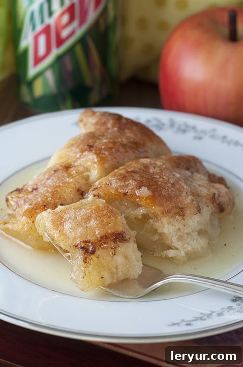 Warm Country Cinnamon Apple Dumplings, glistening with a sweet glaze.