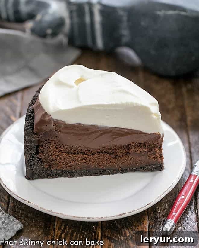 A delectable slice of Mississippi Mud Pie on a pristine white plate, showcasing its distinct layers.