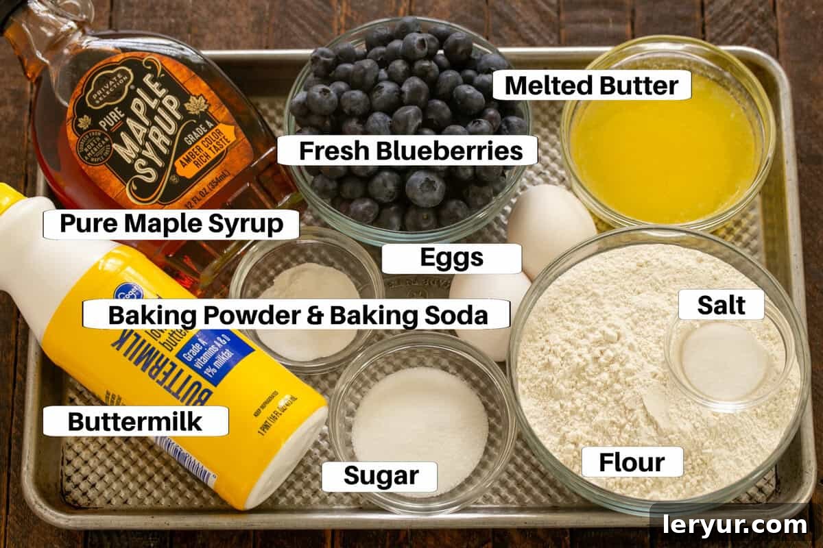 Yaban Mersinli Akçaağaç Şuruplu Ayranlı Pankekler 3 Pancake ingredients, including flour, buttermilk, eggs, and butter, laid out on a metal sheet pan.