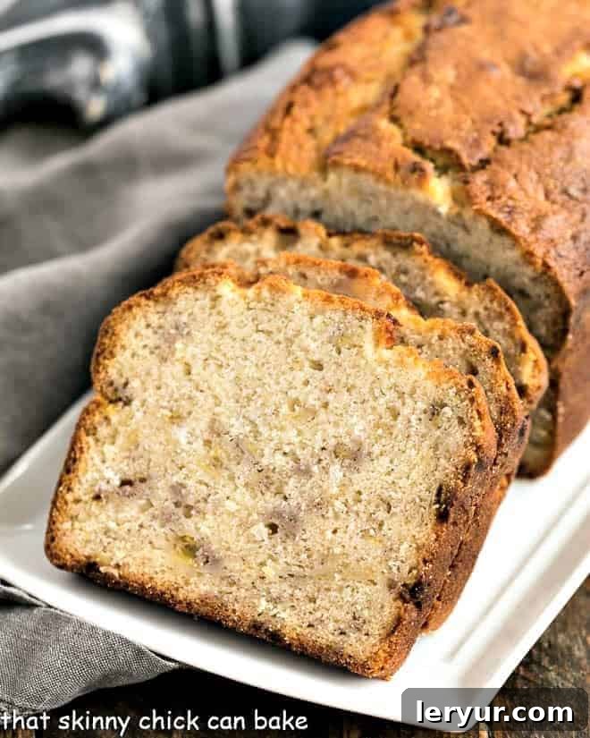 Buttermilk Banana Bread slices on a white ceramic tray