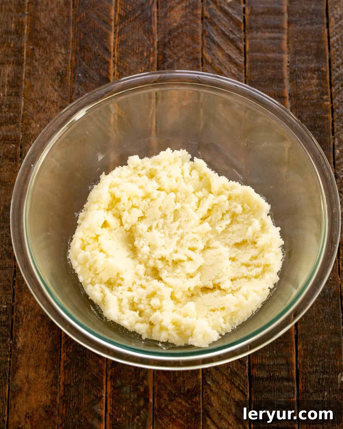 Velvety Buttermilk Banana Bread 4 Butter and sugar being creamed together in a mixing bowl.