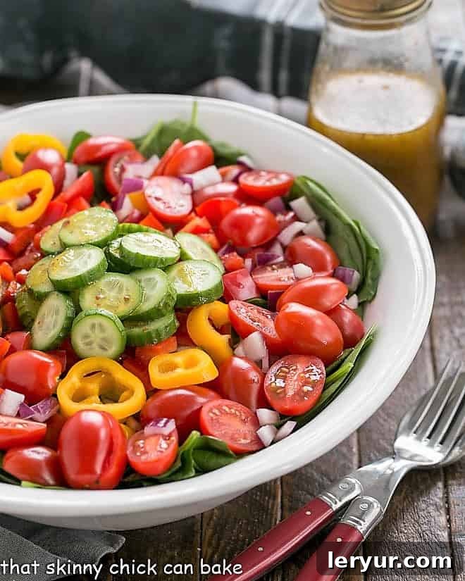Gazpacho Spinach Salad Recipe - a refreshing vegetable salad with a piquant red wine vinaigrette Gazpach Spinach Salad dressed with a red wine vinaigrette.