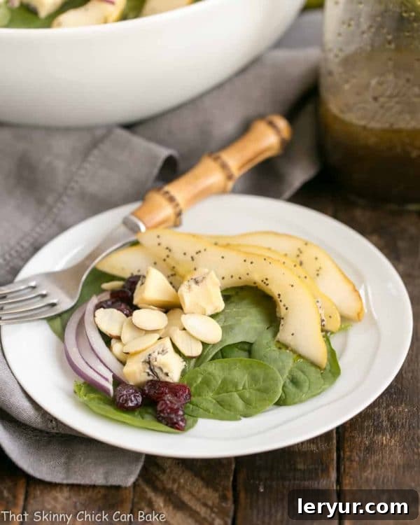 Gourmet Pear Cranberry and Blue Cheese Salad 2 Pear Spinach Salad with Poppy Seed Dressing | A terrific autumn or winter salad with an out of this world salad dressing!