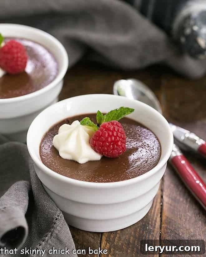 Chocolate Pots de Crème with White Chocolate Whipped Cream in white ramekins