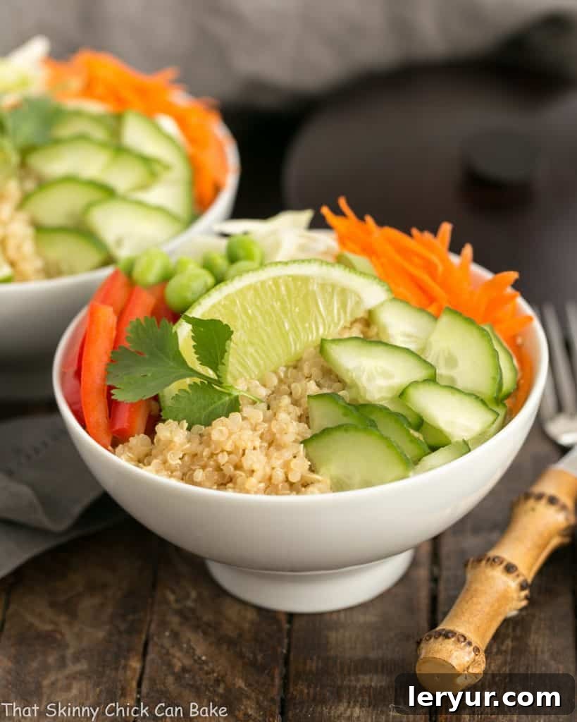 Side view of two Thai Vegetable Quinoa Salad bowls, beautifully arranged.