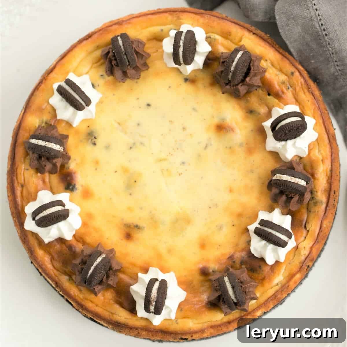 An inviting overhead view of a beautifully prepared Oreo Cheesecake with an Oreo Cookie Crust, perfect for sharing and indulging.