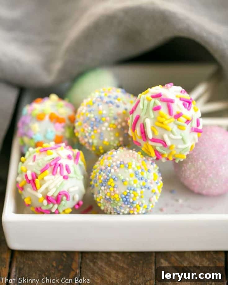 Easter Cake Pops resting on a square plate, ready to be enjoyed.