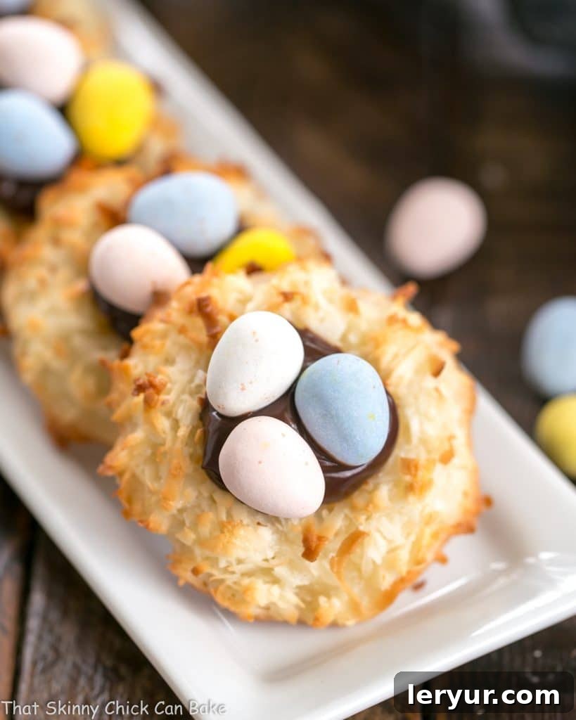 Coconut Macaroon Easter Nests lined up on a thin white tray, ready for an Easter celebration