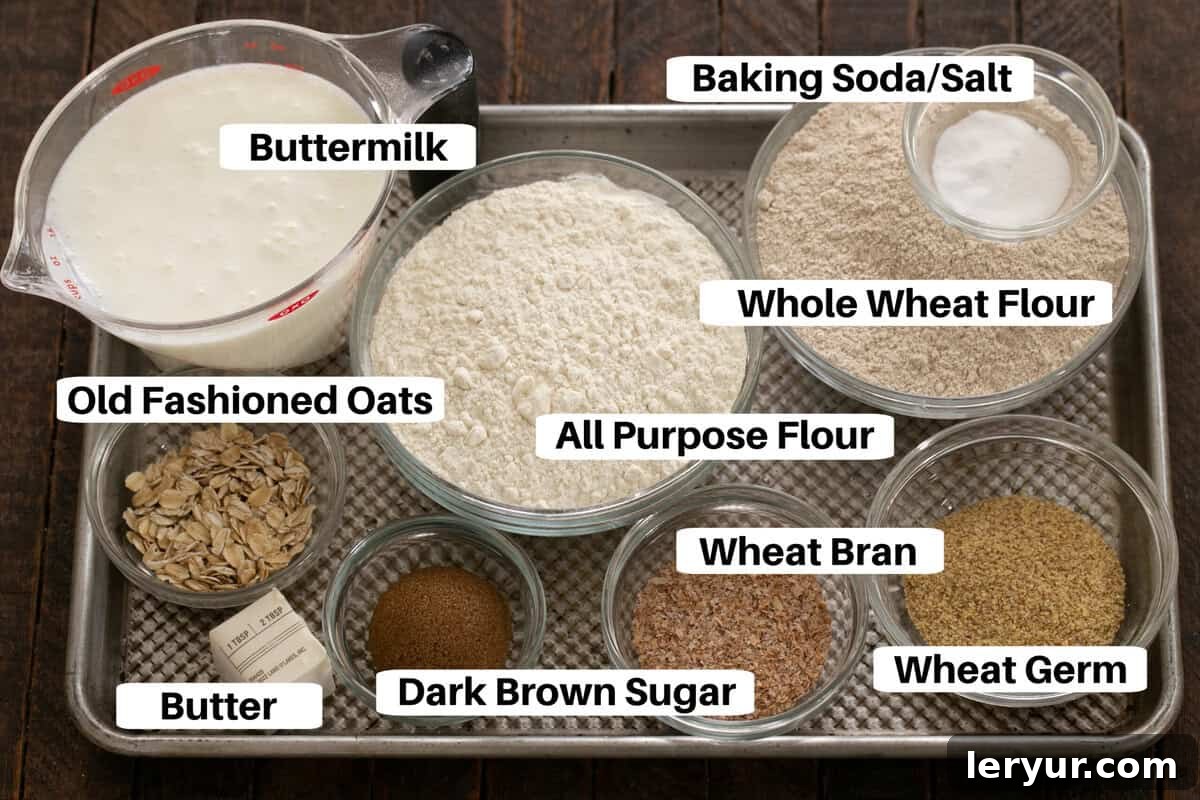Effortless Traditional Irish Soda Bread 2 Irish Brown Bread Ingredients laid out on a sheetpan with labels, including flours, oats, buttermilk, and butter.