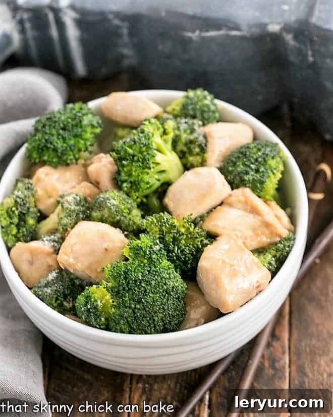 Chicken and Broccoli Stir Fry - A speedy, delicious meal with an Asian flair. Make better than take out at home! Overhead view of broccoli chicken in a white ceramic bowl