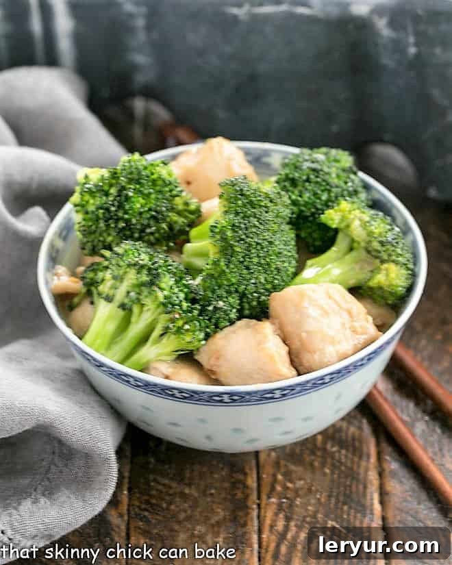 Broccoli and Chicken Stir Fry - A speedy, delicious meal with an Asian flair. Make better than take out at home! broccoli and chicken in a blue and white ceramic bowl