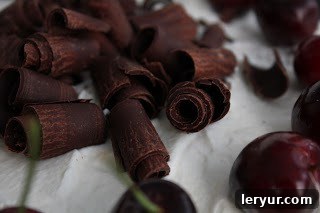 Hands preparing the Black Forest Cake batter