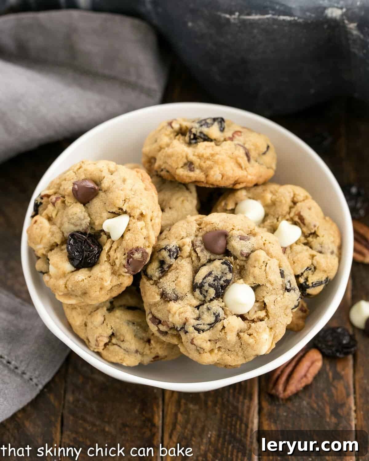Ultimate Chewy Oatmeal Cookies Packed with Chocolate Pecans Dried Cherries 2 Overhead view of a bowl of oatmeal cherry chocolate chip cookies.