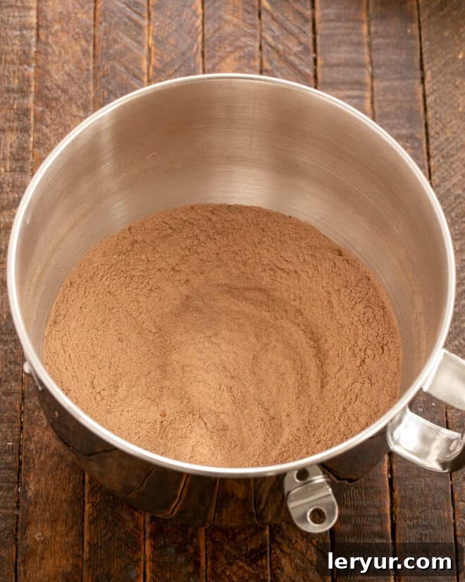 Velvet Night Snack Cakes 4 Dry ingredients for Black Magic Snack Cake in a mixing bowl, prior to combining, ensuring a smooth start to the batter.