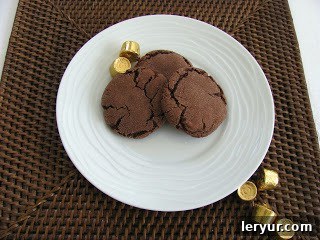 Unwrapped Rolo candies ready to be embedded in cookie dough