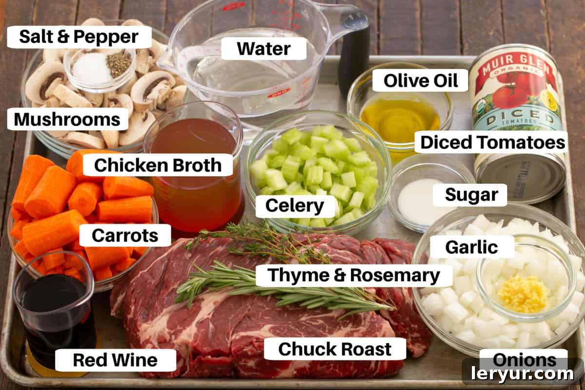 Red Wine Braised Pot Roast with Mushrooms and Tomatoes 2 Pot Roast Ingredients with labels on a metal sheet pan.