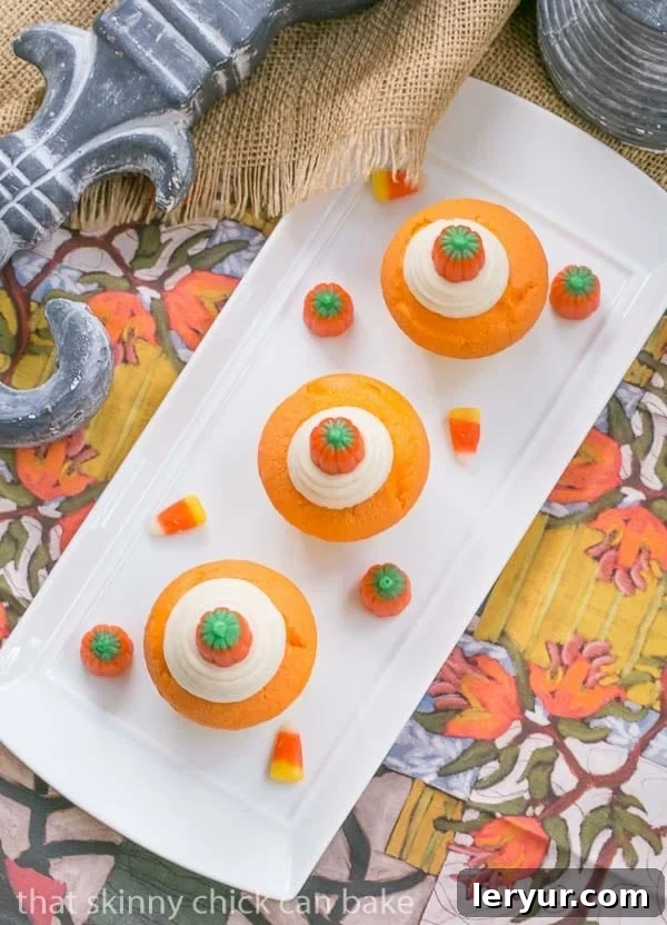 Overhead view of Candy Corn Cupcakes on a white rectangular plate