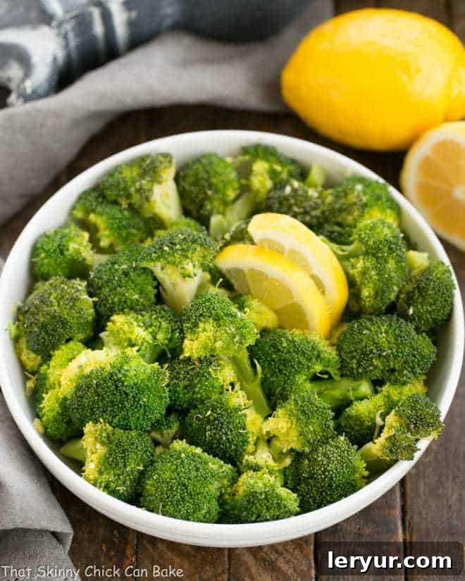 Vibrant Lemon Garlic Broccoli 2 A white ceramic bowl filled with broccoli, seasoned with Garlic and Lemon.