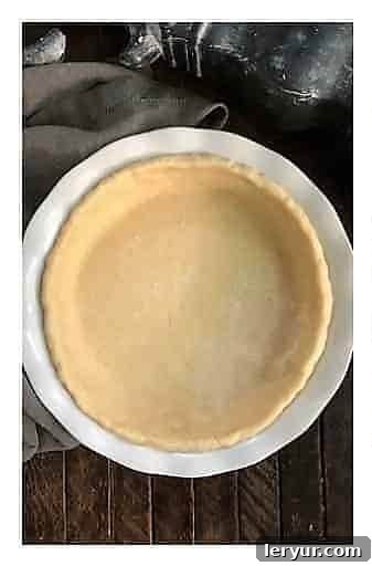 Peach Crumb Pie Step 1: Fitting the pastry crust into the pie pan.