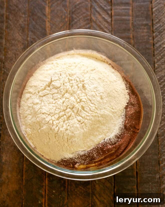 Step 2: Sift together flour, Dutch-process cocoa powder, baking soda, and salt into a separate bowl.