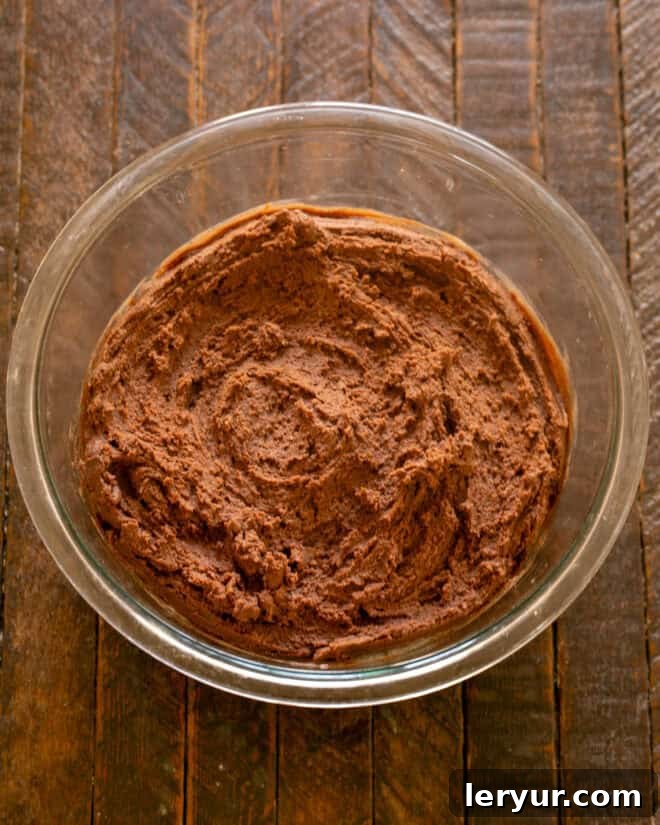 Step 3: Gradually add the sifted dry ingredients to the wet ingredients, mixing until just blended.