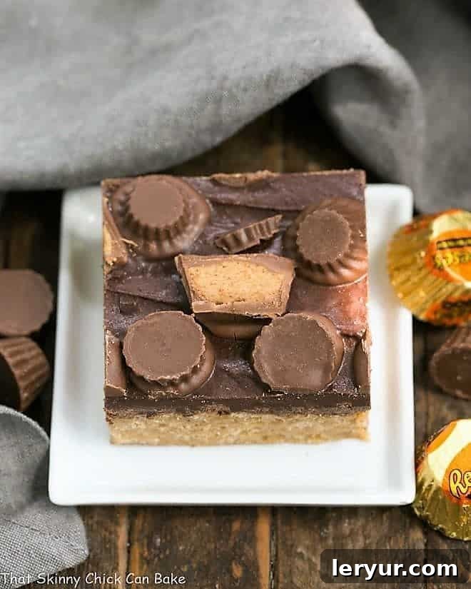 Reeses Rice Krispie Treats on a small white square ceramic plate.