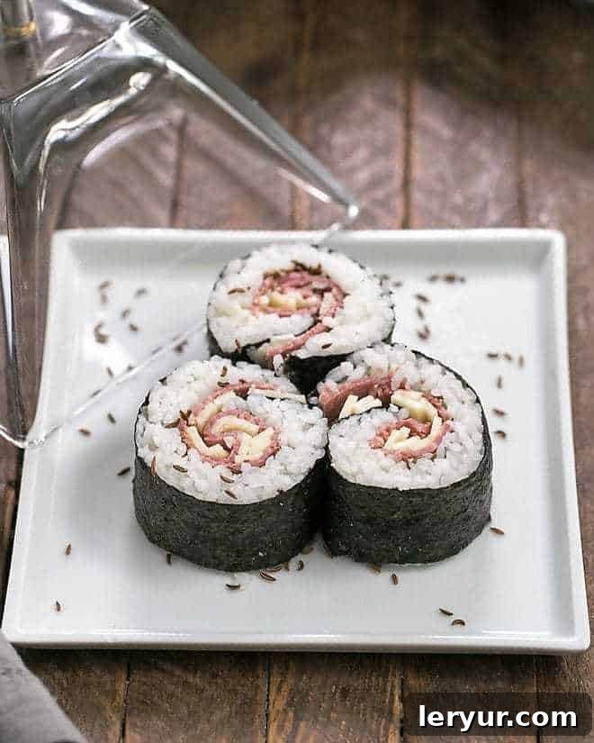 Elegant New York Deli Rolls showcased on a pristine white square plate, emphasizing their unique blend of flavors and meticulous preparation.