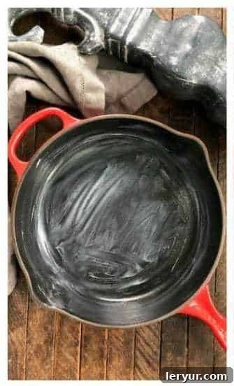 Grease a cast iron skillet with butter or cooking spray.