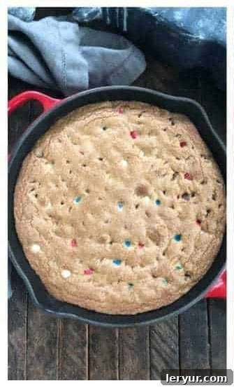 Patriotic skillet cookie baking in the oven until golden brown.