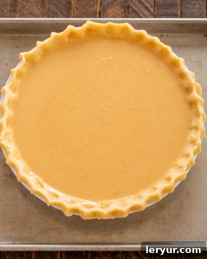 The Secret to Sublime Pumpkin Pie 6 Step by step photos illustrating how to make a classic pumpkin pie recipe, including pouring the filling into the crust.