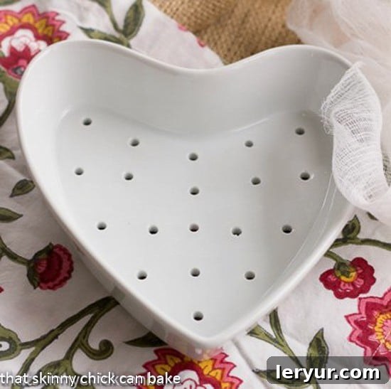 Coeur a la Creme dish on a floral napkin, beautifully presented