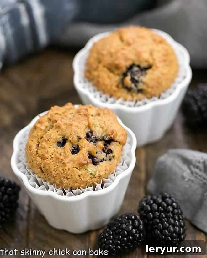 Blackberry Bran Muffins with grated zucchini and full of juicy, plump berries Blackberry Bran Muffins in white ceramic ramekins