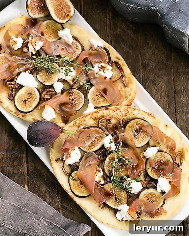 Fig, Goat Cheese and Prosciutto Pizza - fig pizzas are an elegant starter for all your entertaining needs while fresh figs are in season! Fig, Goat Cheese and Prosciutto Pizza on a white platter with fresh figs.