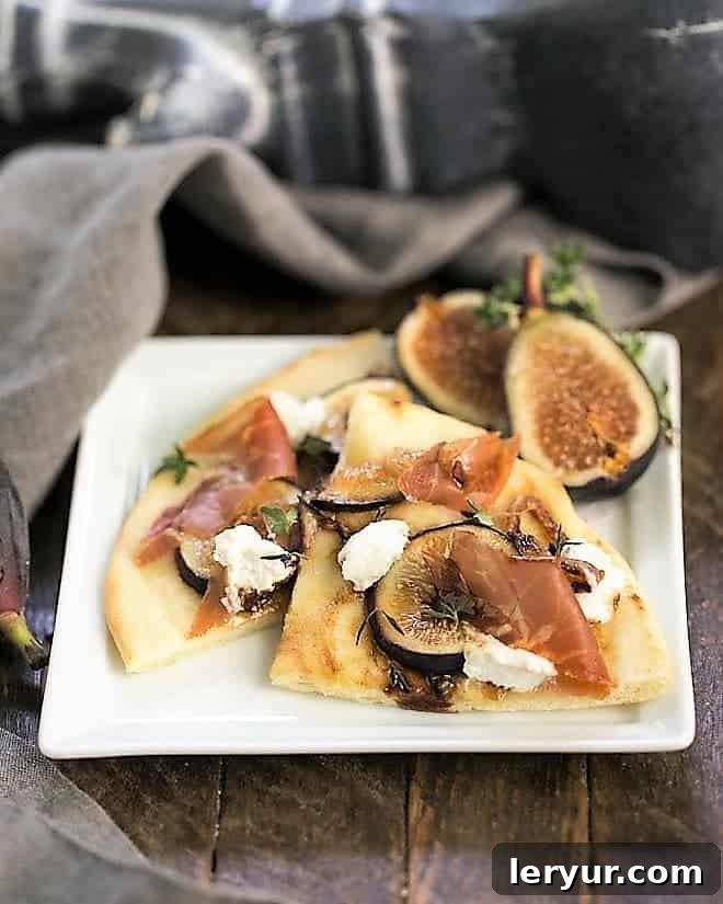 Fig, Goat Cheese and Prosciutto Pizza slices on a square white plate