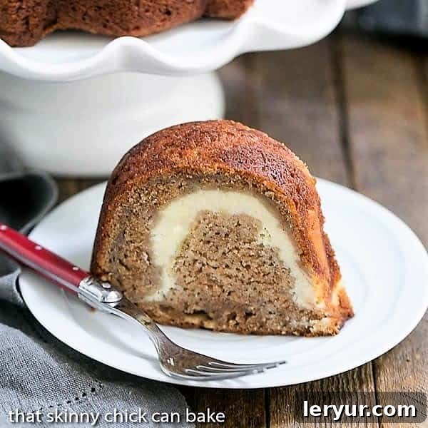 A delectable Apple Bundt Cake with a surprise cream cheese filling in the center.