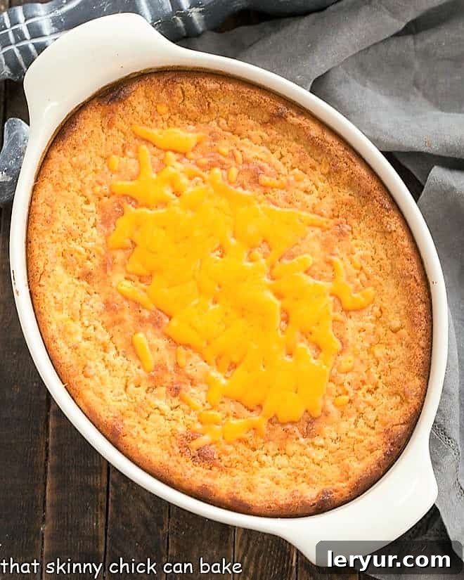 Easy Corn Casserole Recipe - a simple, creamy, and flavorful corn pudding side dish that's perfect for any meal! Easy Corn Casserole Recipe in a white baking dish, ready to serve.