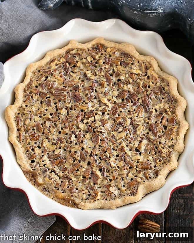 Golden Pecan Perfection 2 Classic Pecan Pie in a red pie plate overhead view