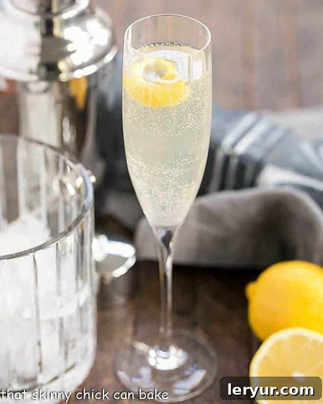 French 75 Champagne Cocktail - a festive citrus sparkler with gin, lemon juice, simple syrup and champagne! Sure to dazzle anyone who takes a sip! French 75 Champagne Cocktail in a champagne flute, perfectly garnished with a lemon twist.