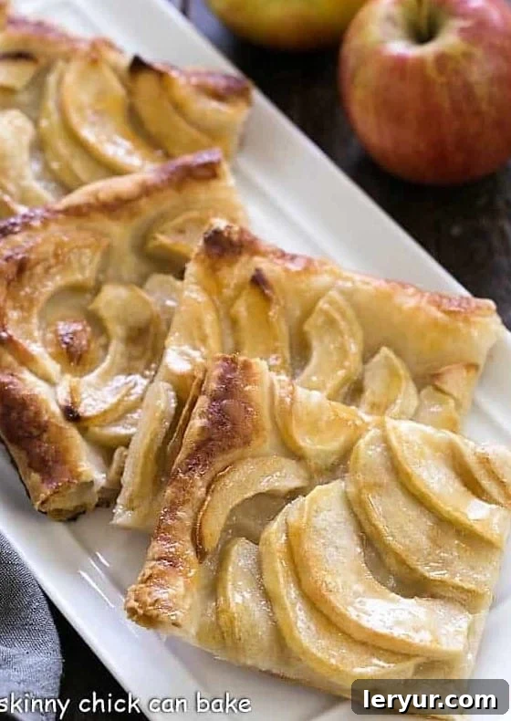 A slice of French Apple Tart resting on a plate, ready to be served.