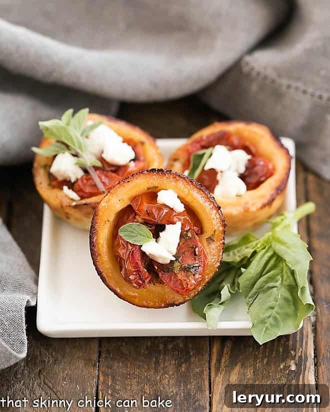 Cheese Straw Tomato Tartlets on a square white plate