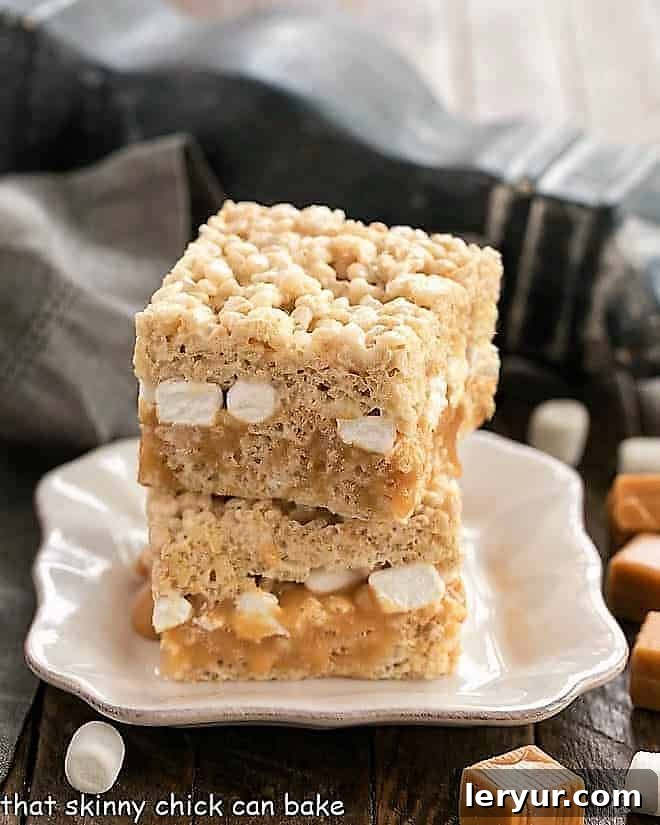 Caramel Stuffed Rice Krispie Treats on a square white plate.
