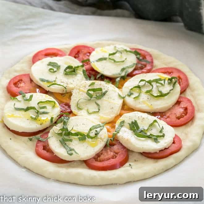 Classic Pizza Dough - A quick yeast bread that will make your pizza taste like it came from a fine Italian pizzeria Uncooked classic pizza dough with toppings ready for the oven