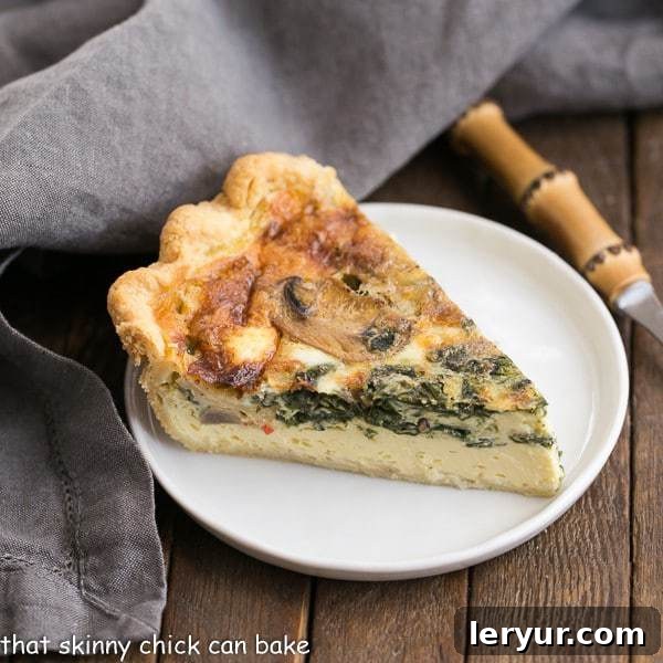 A vibrant and savory Spinach Mushroom Quiche with a golden crust, sliced and ready to serve for brunch or dinner.