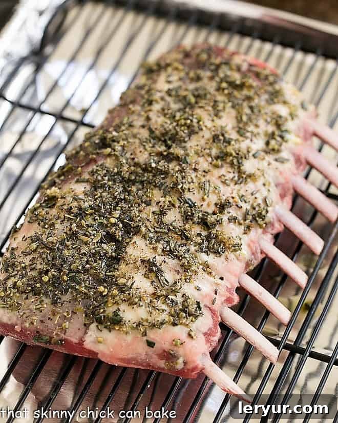 Herb Crusted Rack of Lamb with Parsley Pesto - an elegant, delicious entree for company, Easter dinner or whenever tender spring lamb is available! Herb Crusted Rack of Lamb marinating on a wire rack.