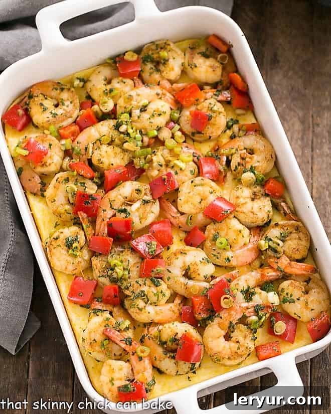 Cheesy Shrimp and Grits Casserole in a white, rectangular casserole dish.
